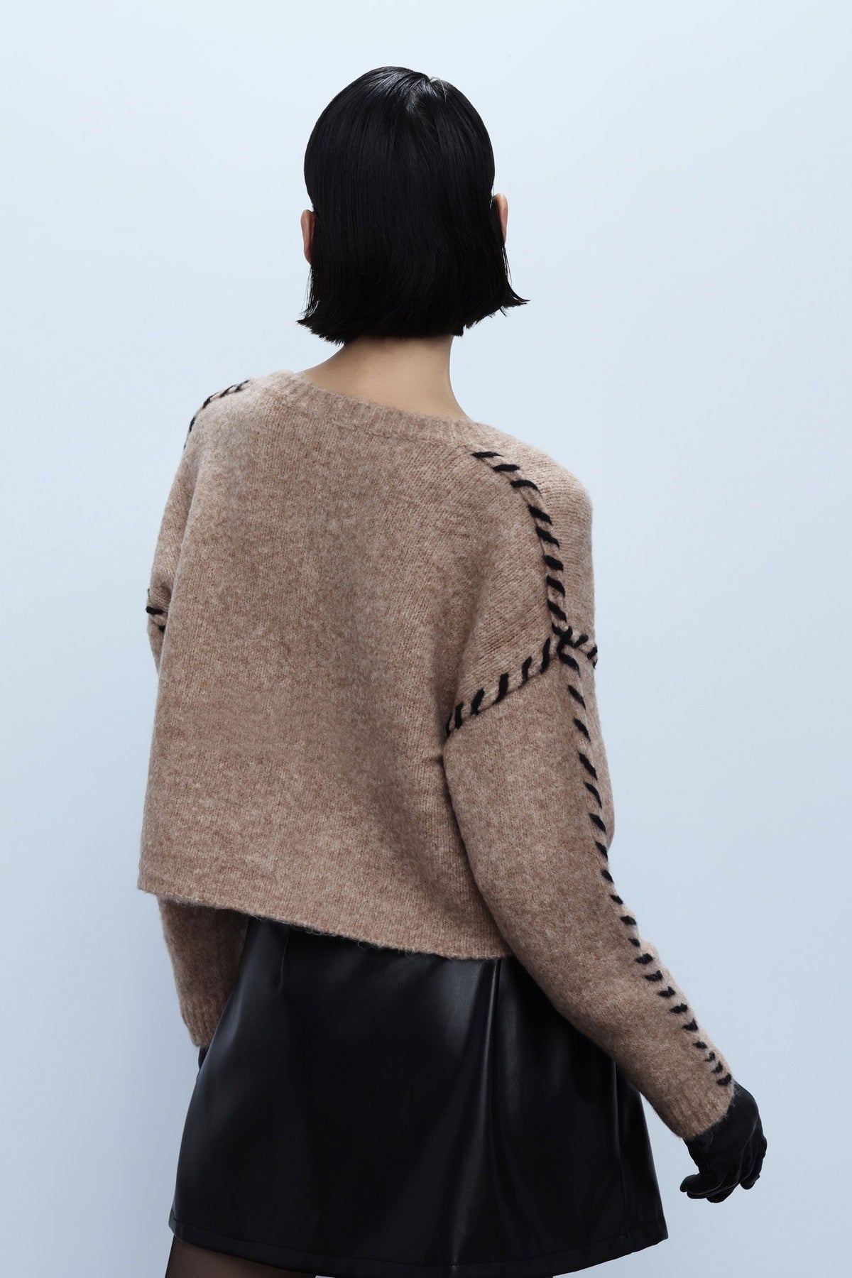 Sweater with crossed side details