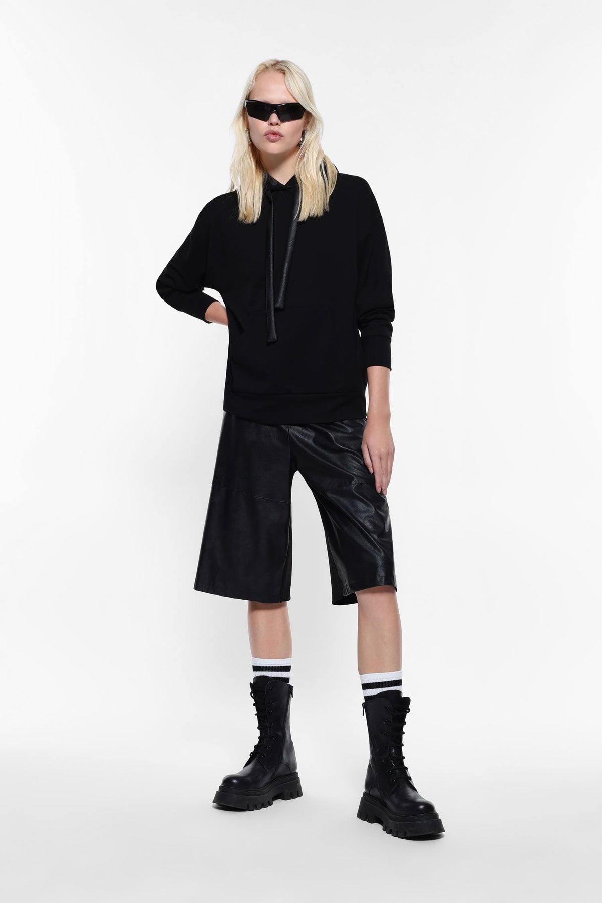 Knee-length shorts in faux leather and fabric