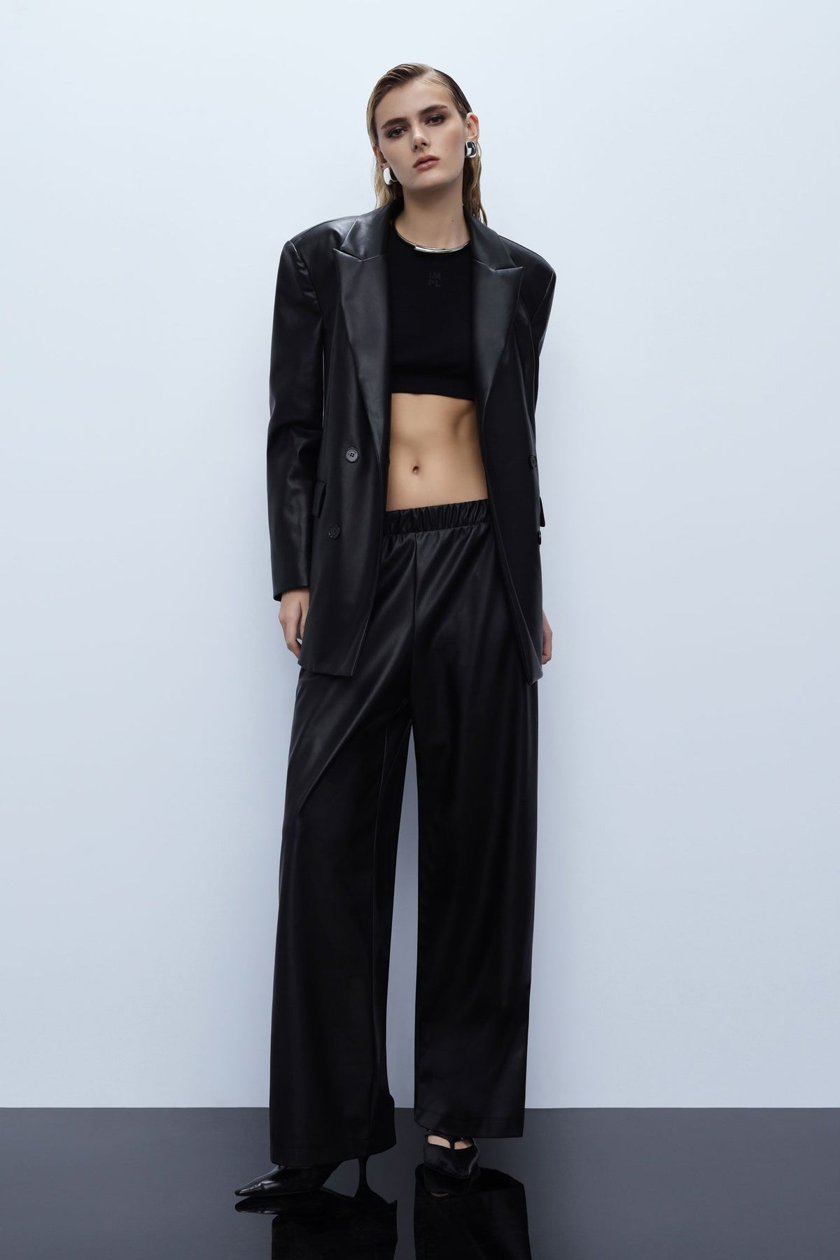 Wide-leg trousers in faux leather