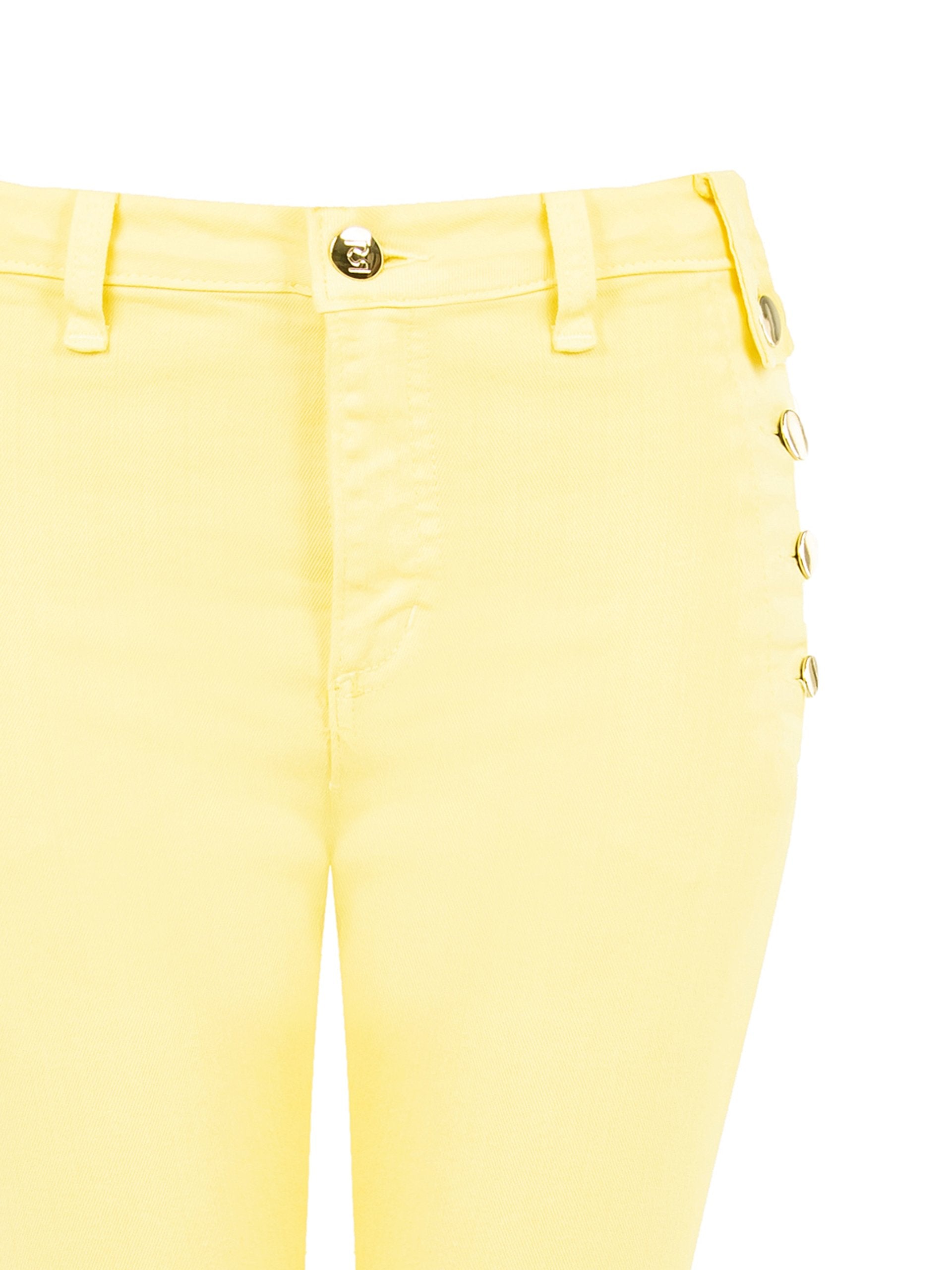 Jean skinny avec boutons latéraux