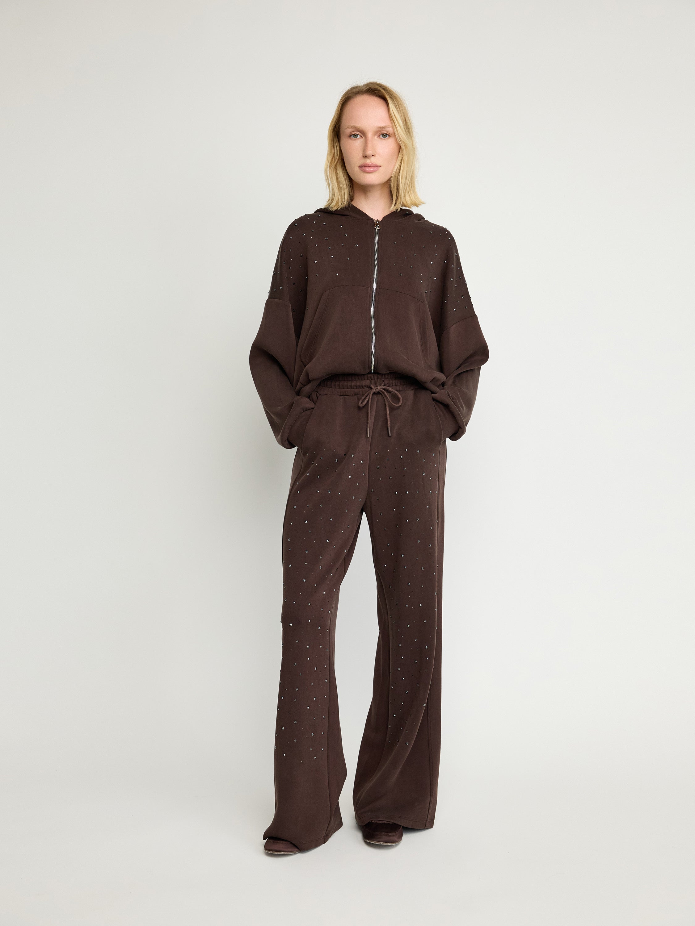Sweat à capuche zippé orné
