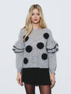 Polka dot sweater with ruffle sleeve detail
