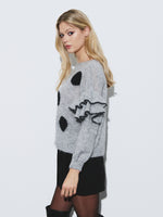 Polka dot sweater with ruffle sleeve detail