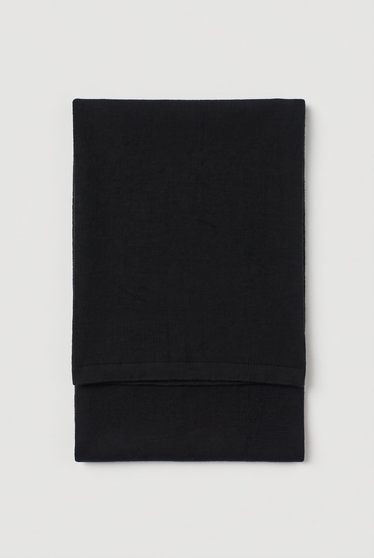 Knitted triangle scarf - Black - flat lay, folded